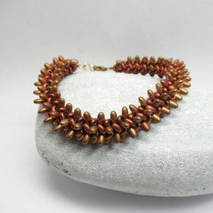 Spiky Copper tone herringbone woven bracelet